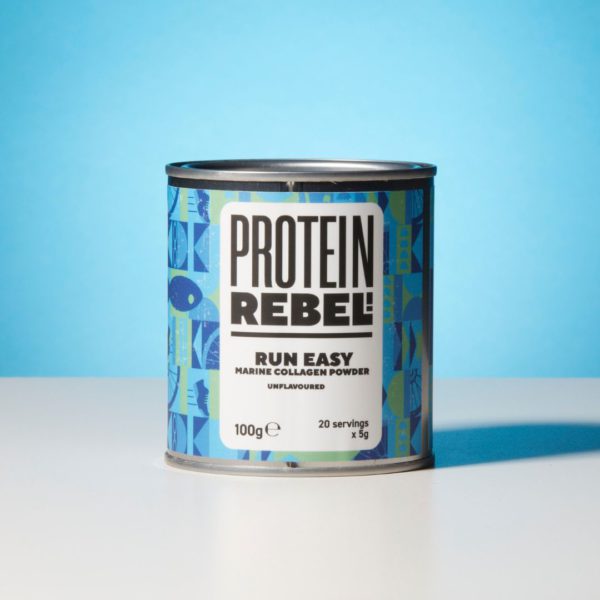 Metal tin of Protein Rebel Run Easy on a table top with blue background